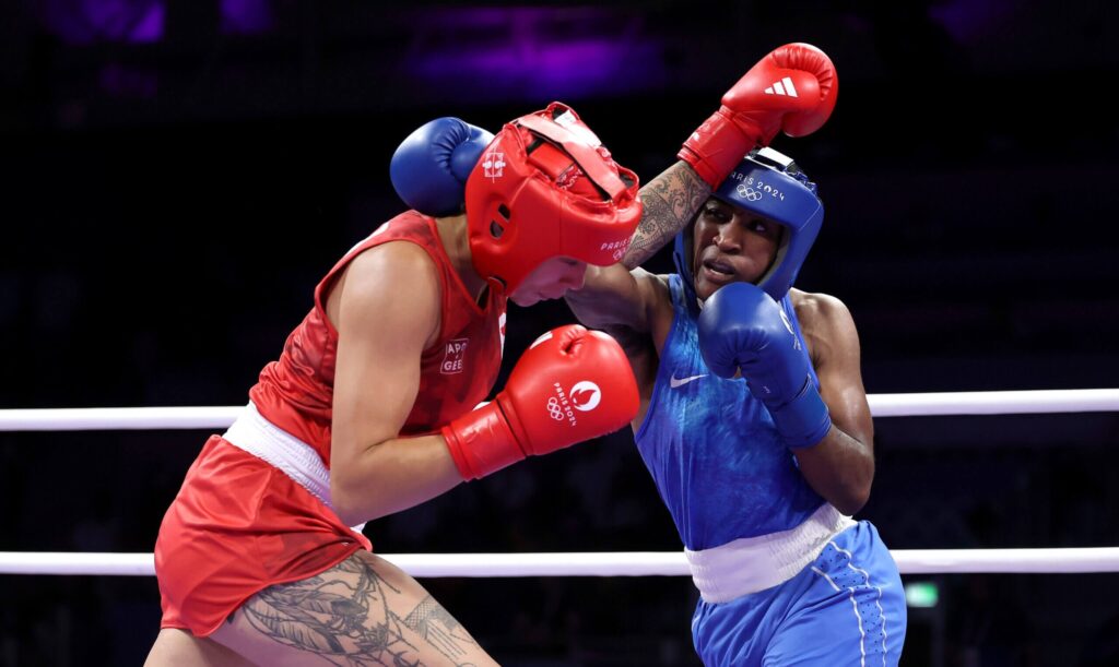 Boxer Cindy Ngamba secures first medal for Olympic refugee team with quarterfinal win