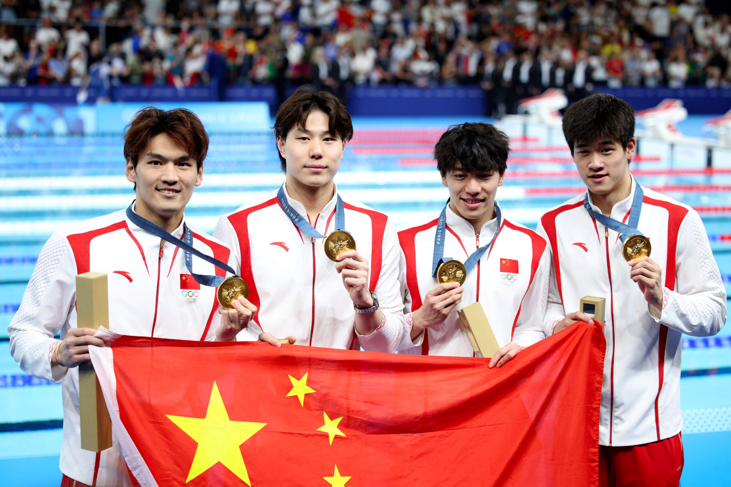 China snaps U.S. men’s streak in Olympic medley relay, closing swim slate full of questions with second gold